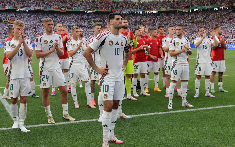 The Hungary players thank their supporters