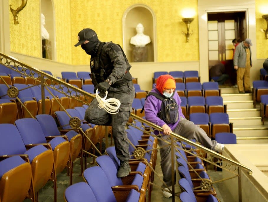 Protesters enter the Senate Chamber on 6 January, 2021 in Washington, DCGetty Images