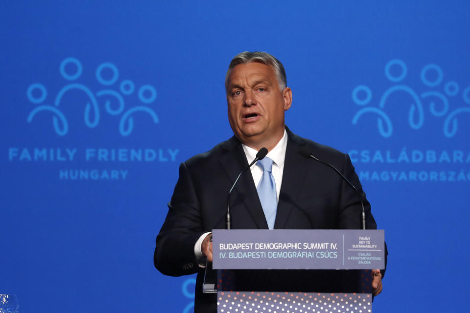 Hungary's Prime Minister Viktor Orban holds a speech during the 4th Budapest Demographic Summit in Budapest, Hungary, Thursday, Sept. 23, 2021. The biannual demographic summit, which was first organized in 2015, offers a forum for "pro-family thinker" decision-makers, scientists, researchers, and church representatives of the same sort to exchange their thoughts about connections between demographics and sustainability. (AP Photo/Laszlo Balogh)