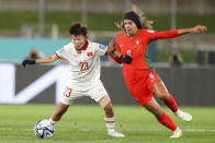 Vietnam's Thi Bich Thuy Nguyen, left, and Portugal's Andreia Jacinto duel for the ball during the Women's World Cup Group E soccer match between Portugal and Vietnam in Hamilton, New Zealand, Thursday, July 27, 2023. The group stage was the source of enormous national pride for Portugal, the Philippines, Vietnam, Panama, Ireland, Haiti, Zambia and Morocco, all newcomers to the highest level of international women's soccer. (AP Photo/Juan Mendez)