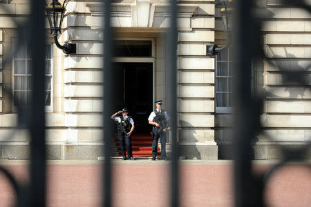 Police officers are seen on duty within the grounds of Buckingham Palace in London, Britain August 26, 2017. REUTERS/Paul Hackett