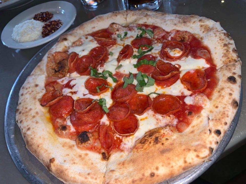 pepperoni pizza from via napoli restaurant in disney world epcot world showcase