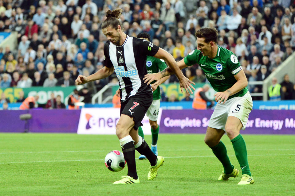 NEWCASTLE UPON TYNE, ENGLAND - SEPTEMBER 21: Andy Carroll of Newcastle United holds off Lewis Dunk of Brighton and Hove Albion during the Premier League match between Newcastle United and Brighton & Hove Albion at St. James Park on September 21, 2019 in Newcastle upon Tyne, United Kingdom. (Photo by Mark Runnacles/Getty Images)