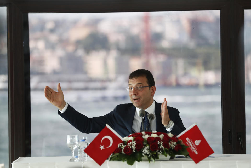 Ekrem Imamoglu, the new Mayor of Istanbul from Turkey's main opposition opposition Republican People's Party (CHP) talks to members of foreign media a day after he took over office, in Istanbul, Friday, June 28, 2019. Imamoglu said Friday he was prepared against any attempts by the government to restrict his powers while emphasizing his willingness to work with Turkish President Recep Tayyip Erdogan.(AP Photo/Lefteris Pitarakis)