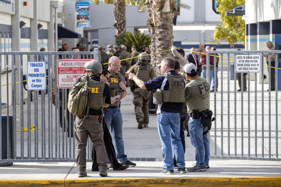 FBI and other law enforcement gather at the scene following a shooting at Saugus High School, Thursday, Nov. 14, 2015 in Santa Clarita, Calif. (Hans Gutknecht/The Orange County Register via AP)