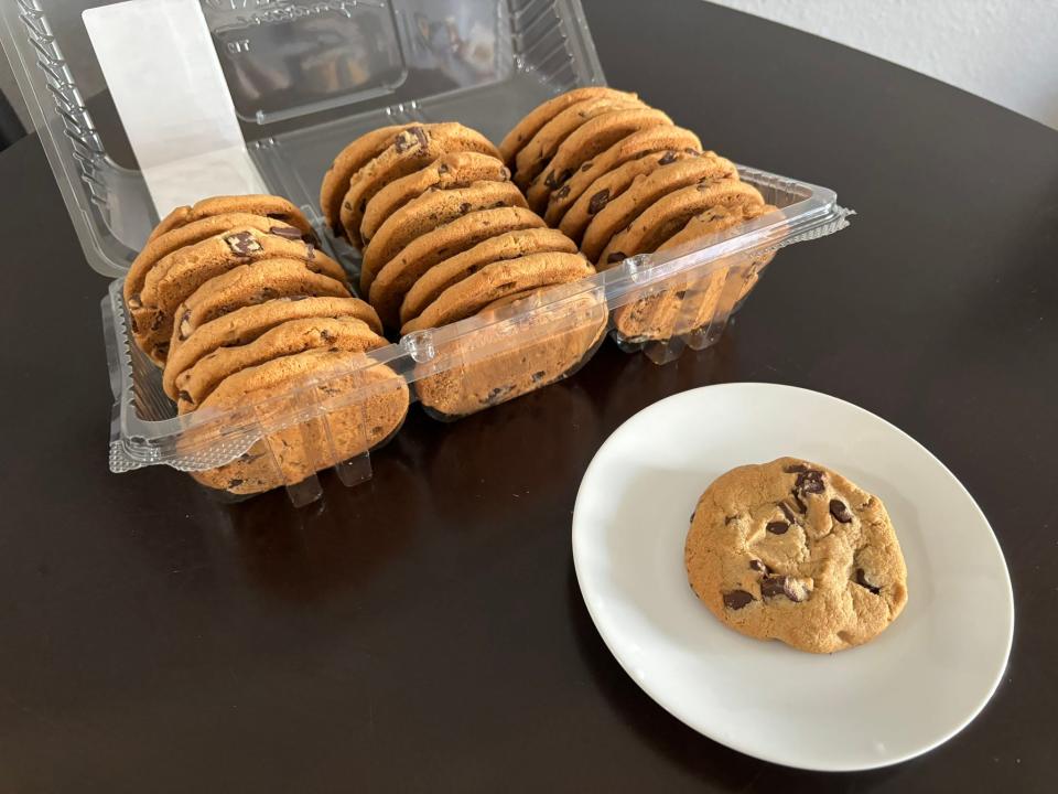 Kirkland Bakery chocolate-chunk cookies in plastic package next to plate with cookie on it 