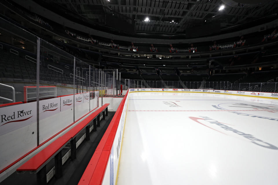 WASHINGTON, DC - MARCH 12: The ice, player's bench, and spectator seating are empty prior to the Detroit Red Wings playing against the Washington Capitals at Capital One Arena on March 12, 2020 in Washington, DC. Yesterday, the NBA suspended their season until further notice after a Utah Jazz player tested positive for the coronavirus (COVID-19). The NHL said per a release, that the uncertainty regarding next steps regarding the coronavirus, Clubs were advised not to conduct morning skates, practices or team meetings today. (Photo by Patrick Smith/Getty Images)