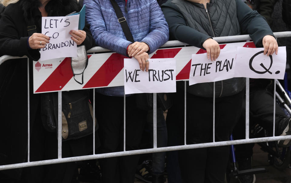 People gather for a protest against the COVID-19 vaccination green pass, attended by Robert F. Kennedy Jr., son of Robert Kennedy, in Milan, Italy, Saturday, Nov. 13, 2021. (AP Photo/Antonio Calanni)