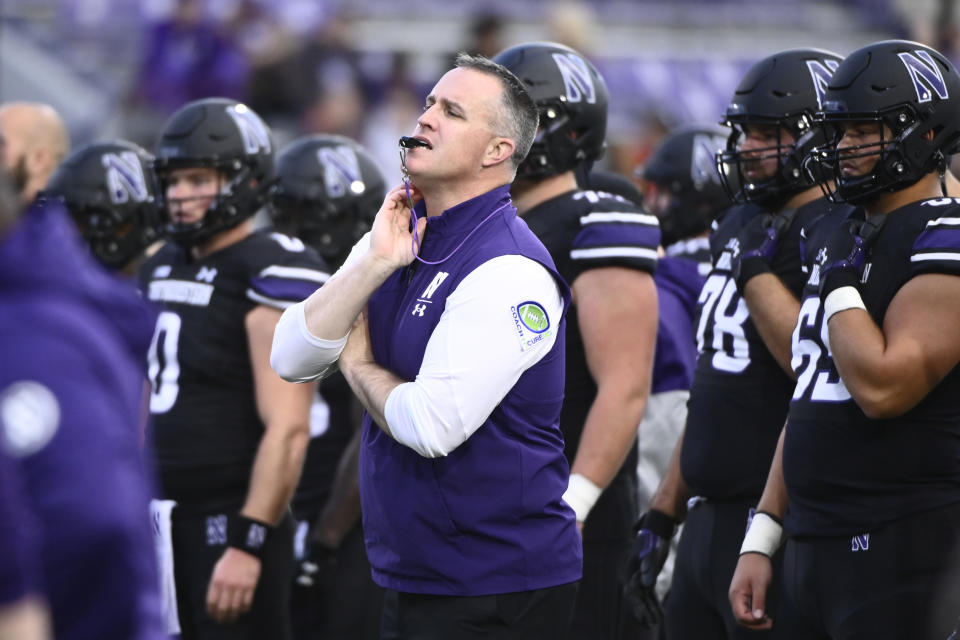 FILE - Northwestern head football coach Pat Fitzgerald directs the team before an NCAA college football game against Miami (Ohio) Saturday, Sept. 24, 2022, in Evanston, Ill. An attorney for former Northwestern football coach Pat Fitzgerald urged a judge Tuesday, Feb. 13, 2024, to move up the trial in a dispute over his firing, saying he can't get another major job until he puts a hazing scandal behind him.(AP Photo/Matt Marton, File)