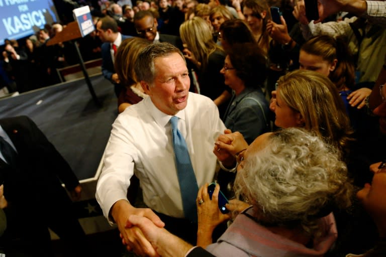 Ohio Governor and Republican presidential candidate John Kasich greets supporters at a primary election watch party after finishing second to Donald Trump, February 9, 2016, in Concord, New Hampshire