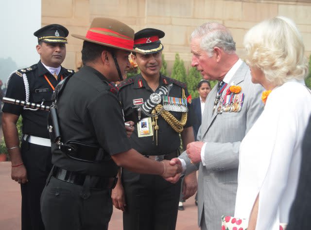 Charles and Camilla meet Gurkha soldiers during a visit to India Gate for a wreath laying ceremony, in New Delhi