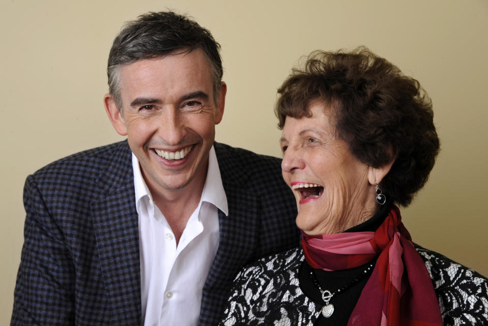 In this Wednesday, Nov. 13, 2013 photo, Philomena Lee, right, shares a laugh with Steve Coogan, a cast member in the film "Philomena," as they pose together for a portrait at the Four Seasons Hotel in Beverly Hills, Calif. The British comic, Coogan, and Oscar-winning actress, Judi Dench, co-star in the film opening Friday, Nov. 22, 2013, which explores the benefits and costs of faith through the true story of Philomena Lee. (Photo by Chris Pizzello/Invision/AP)