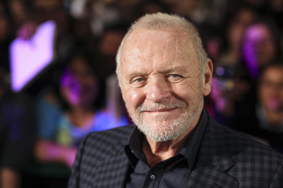 FILE - In this Feb. 15, 2011 file photo, Anthony Hopkins smiles while posing for photos prior to the premiere of his new film "The Rite" in Mexico City. “Nomadland” has won four prizes, including best picture, at the British Academy Film Awards on Sunday, April 11, 2021. The film’s director, Chloe Zhao, became only the second woman to win the best director trophy, and star Frances McDormand was named best actress. “Nomadland” also took the cinematography prize on Sunday. Emerald Fennell’s revenge comedy “Promising Young Woman” was named best British film, while the best actor trophy went to 83-year-old Anthony Hopkins for playing a man grappling with dementia in “The Father.” An event that was criticized in the recent past with the label #BAFTAsSoWhite rewarded a diverse group of talents, during a pandemic-curbed ceremony at London’s Royal Albert Hall. (AP Photo/Alexandre Meneghini, File)