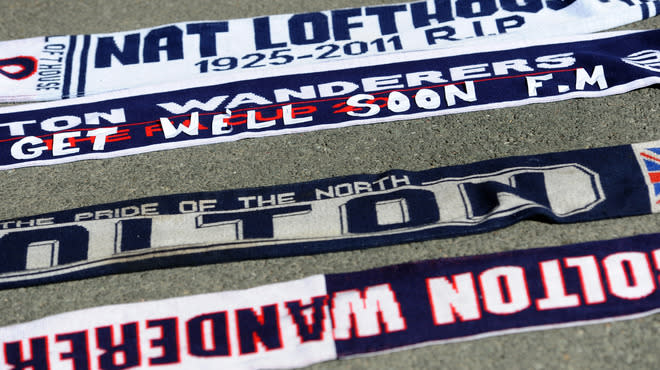 A football scarf with a message of support is left at the stadium's Book of Remembrance at The Reebok Stadium in Bolton, north-west England on March 18, 2012 the morning after Bolton Wanderers' English midfielder Fabrice Muamba collapsed during their FA cup football match against Tottenham Hotspur in London. Muamba remains in 'critical condition' according to the hospital. (Photo by Paul Ellis/AFP/Getty Images)