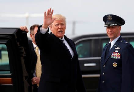 FILE PHOTO: U.S. President Donald Trump gets into his limo upon his return to Joint Base Andrews in Maryland, U.S., April 22, 2018.  REUTERS/Kevin Lamarque