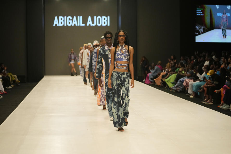 Models display a creation by Abigail Ajobi during the Lagos Fashion Week in Lagos, Nigeria, Thursday, Oct. 26, 2023. Africa's fashion industry is rapidly growing to meet local and international demands but a lack of adequate investment still limits its full potential, UNESCO said Thursday in its new report released at this year's Lagos Fashion Week show. (AP Photo/Sunday Alamba)