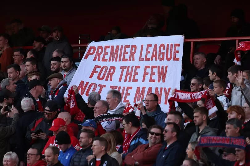 Nottingham Forest fans display a banner reading 'Premier League for the few not the many' at the City Ground against Crystal Palace