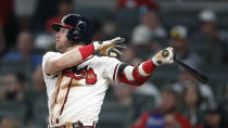 Atlanta Braves' Josh Donaldson ollows through on a solo home run in the sixth inning of a baseball game against the Los Angeles Dodgers, Saturday, Aug. 17, 2019, in Atlanta. (AP Photo/John Bazemore)