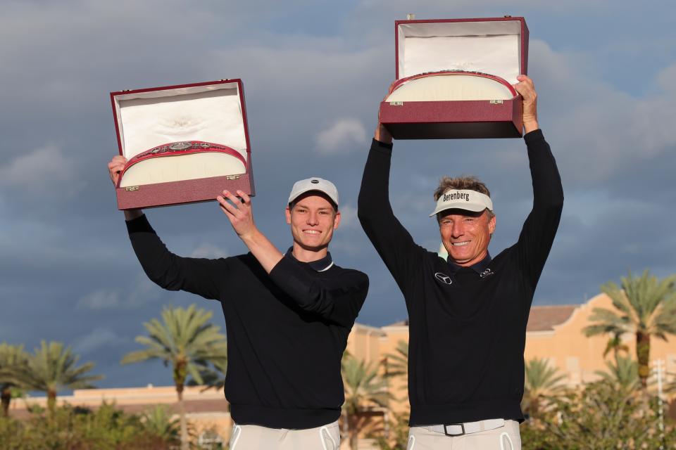 Dec 17, 2023; Orlando, Florida, USA; Bernhard Langer (right) and his son Jason Langer hold up the Champions Belts after winning the PNC Championship at The Ritz-Carlton Golf Club. Mandatory Credit: Reinhold Matay-USA TODAY Sports