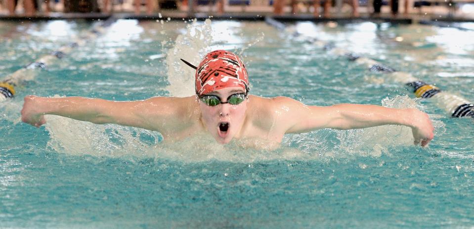 Springfield High School's Will Hovey swims the boys 100-yard butterfly during the Central State Eight Conference boys swimming and diving championship at Eisenhower Pool on Saturday, February 3, 2024.