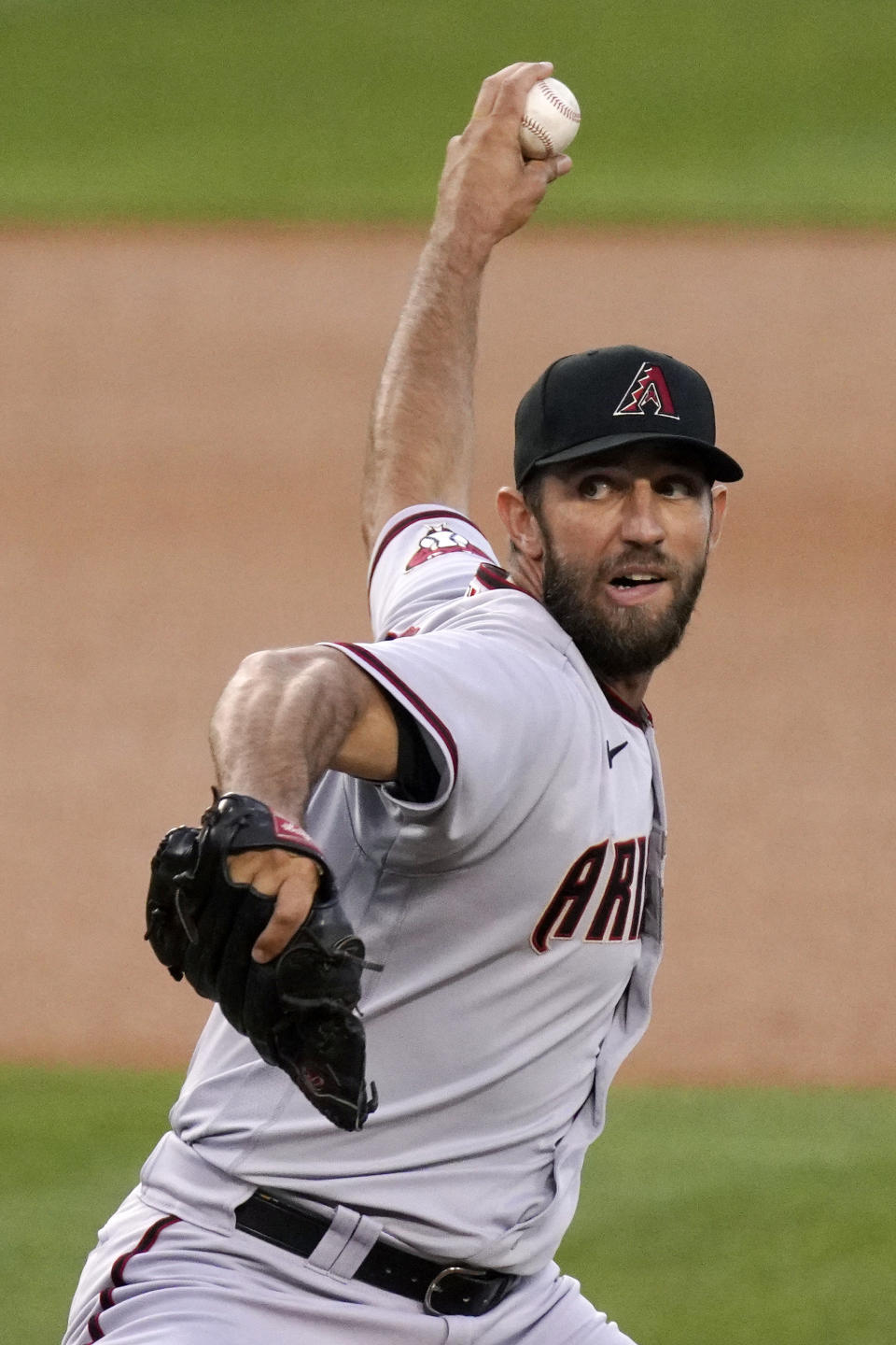 Arizona Diamondbacks starting pitcher Madison Bumgarner throws to the plate during the first inning of a baseball game against the Los Angeles Dodgers Monday, May 17, 2021, in Los Angeles. (AP Photo/Mark J. Terrill)