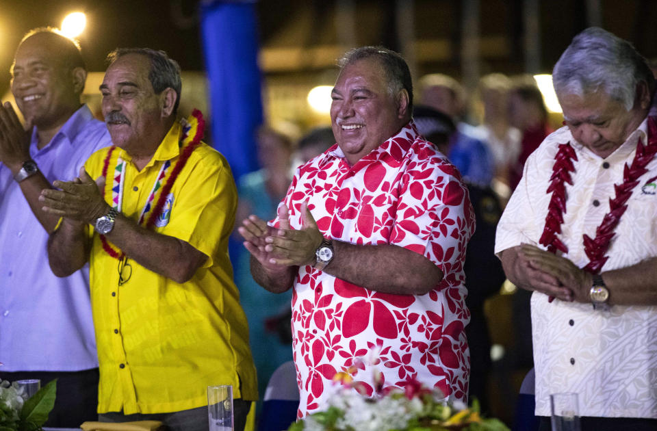 FILE - In this Sept. 3, 2018, file photo, Nauru's President Baron Waqa, center, attends the opening ceremony of the Pacific Islands Forum in Nauru. Waqa was put in the unusual position of facing questions about the refugees from journalists, because the nation of 11,000 people was hosting the Pacific Island Forum, a meeting of regional leaders. For years, Nauru had effectively kept journalists away by charging a fee of 8,000 Australian dollars ($5,750) to apply for media visas. Nauru waived the fee for the forum, but allowed only a handful of journalists into the country and placed restrictions on them. (Jason Oxenham/Pool Photo via AP, File)