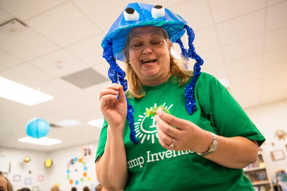 Kelly Cable, Windsor Park Elementary faculty member, displays a robotic fish at Camp Invention at the school on Thursday, June 16, 2022.