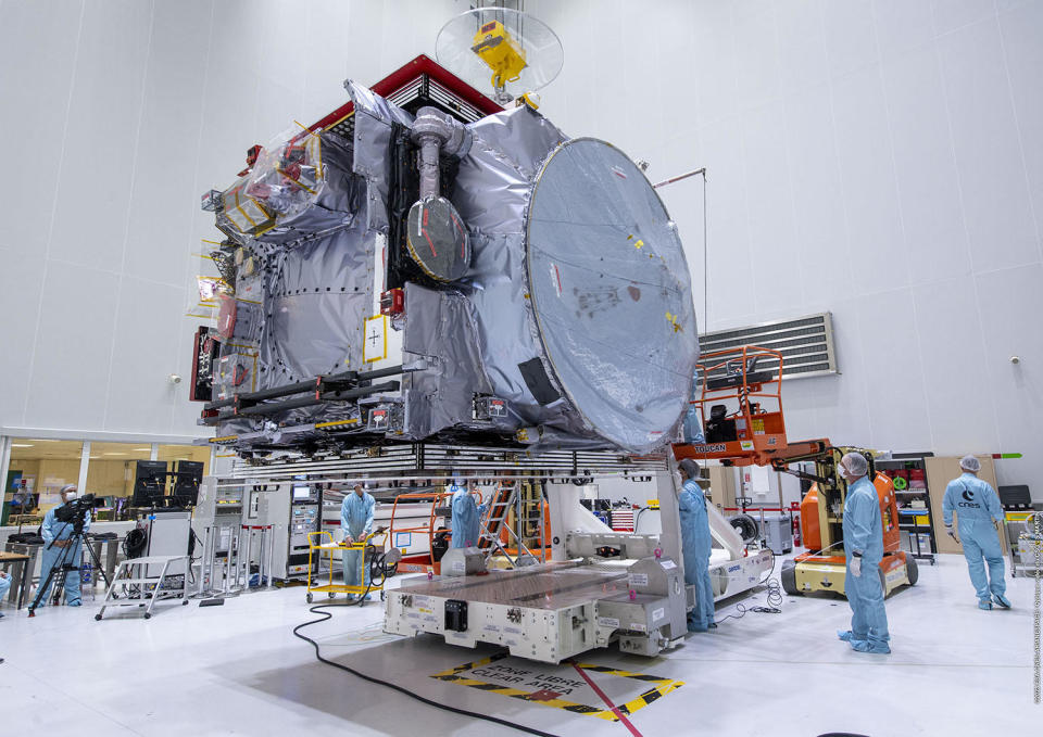 The JUICE spacecraft, its solar arrays folded up at top and bottom, is readied for launch to Jupiter. / Credit: ESA