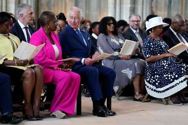 <p>Andrew Matthews - WPA Pool/Getty </p> King Charles III attends a service at St George's Chapel, Windsor Castle on Windrush Day