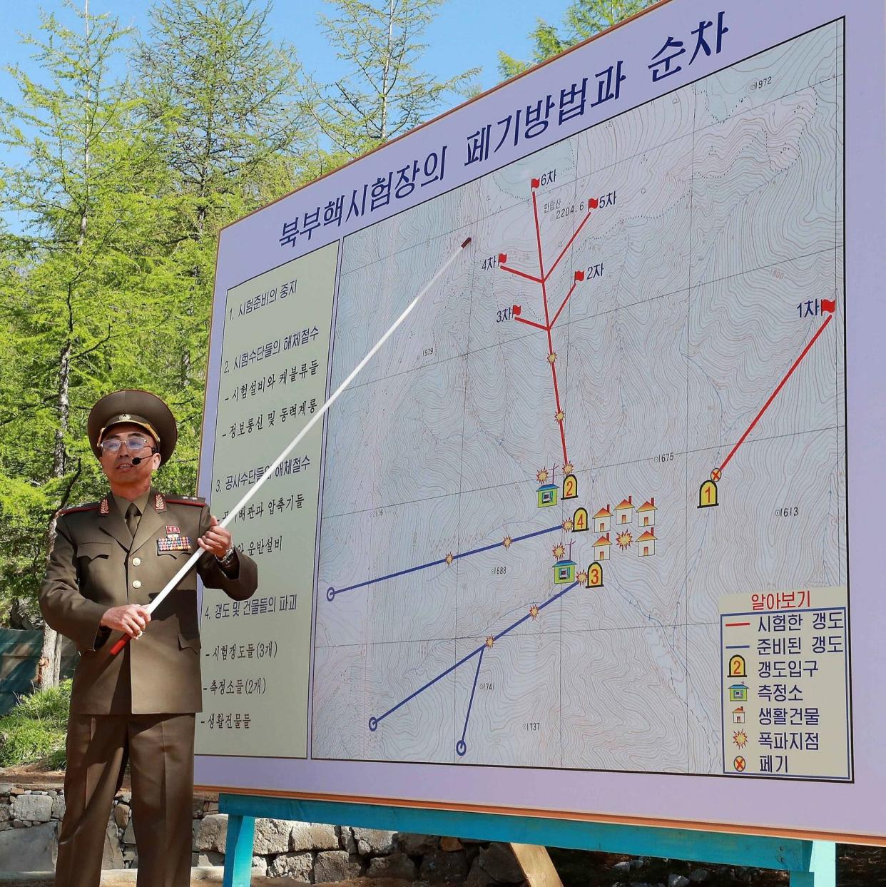 A North Korean soldier explains the demolition process of the Punggye-ri nuclear test facility - Getty Images AsiaPac