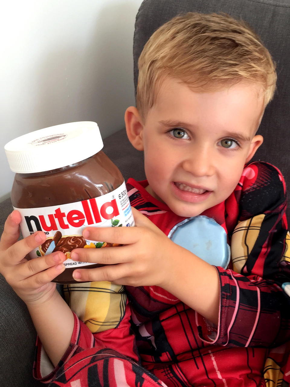 3-year-old Harrison had found the jar of Nutella on a low shelf in the kitchen. Source: Caters News