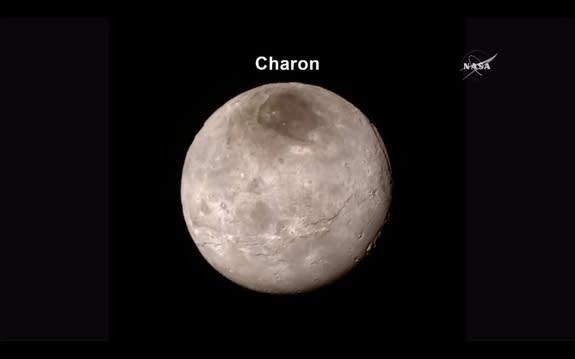 New Horizons provides unprecedented details of Pluto's moon, Charon, as presented in a NASA press conference on July 15, 2015, at the Johns Hopkins University Applied Physics Laboratory, Laurel, Maryland.