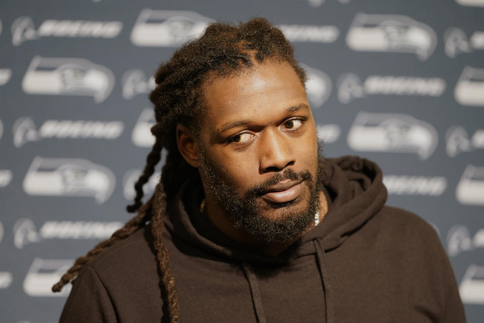 FILE - In this Nov. 11, 2019, file photo, Seattle Seahawks defensive end Jadeveon Clowney speaks at a news conference after an NFL football game against the San Francisco 49ers in Santa Clara, Calif. Even with the status of the upcoming season uncertain because of the coronavirus pandemic, teams continue to tinker with their rosters by adding players they hope will help them win — whenever, or if, they actually play. Many believed Clowney would be snatched up by a team desperate for a pass-rushing presence during the first few days of free agency. And, for big-time bucks. Instead, the 2014 No. 1 overall pick is still unsigned two months later and potentially looking at a one-year, prove-it deal. A return to Seattle isn't out of the question. (AP Photo/Tony Avelar, File)