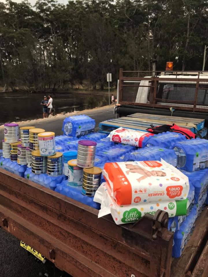 A Woolworths manager helped Shoalhaven locals load up a ute with water and baby supplies.