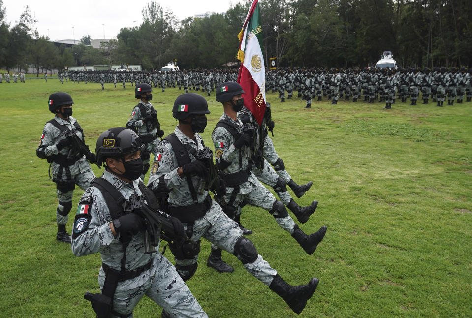 Members of the National Guard's newly created Special Force of Reaction and Intervention (FERIA) hold a presentation ceremony in Mexico City, Tuesday, Aug. 16, 2022. (AP Photo/Marco Ugarte)