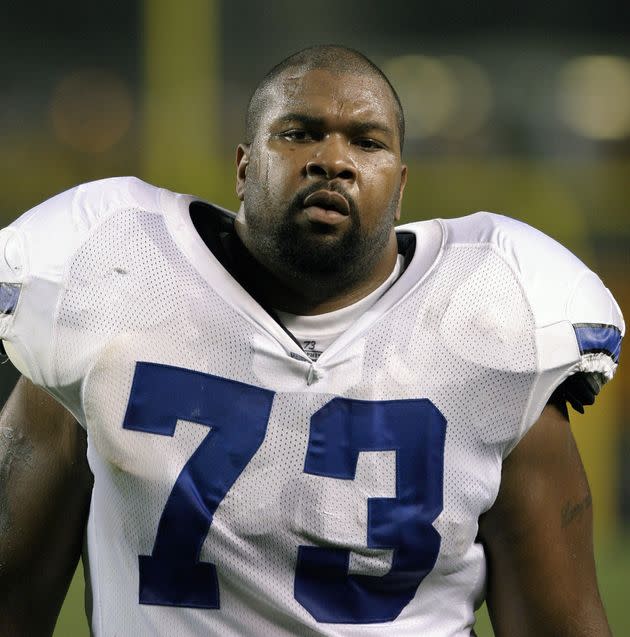 Larry Allen looks on from the sideline during a game against the Pittsburgh Steelers on Aug. 21, 2003. The storied offensive lineman died Sunday while vacationing in Mexico with his family.