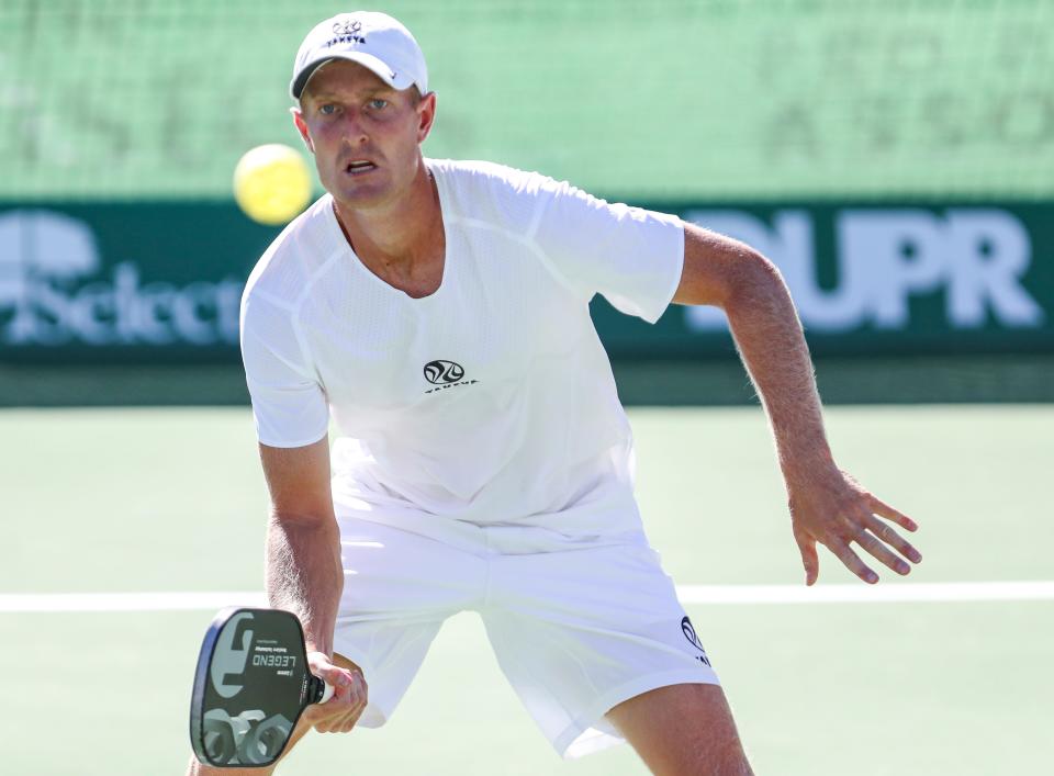 Professional player Riley Newman keeps his eyes on the ball while playing mixed doubles during the Pro Pickleball Association Masters tournament at the La Quinta Resort and Club, Friday, Nov. 12, 2021, in La Quinta, Calif. 