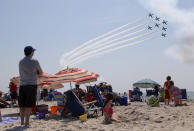 <p>Spectators watch the Breitling Jet Team perform over Jones Beach during the 13th Annual Bethpage Air Show, Saturday, May 28, 2016, at Jones Beach, in Wantagh, N.Y. (AP Photo/Julie Jacobson) </p>