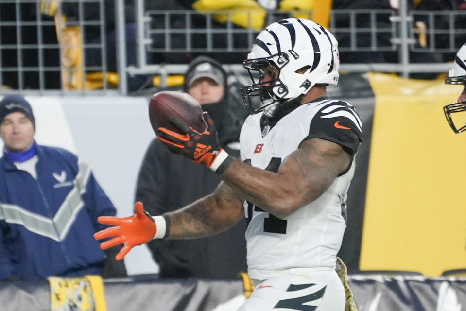 Cincinnati Bengals running back Samaje Perine (34) celebrates after scoring a touchdown against the Pittsburgh Steelers during the first half of an NFL football game, Sunday, Nov. 20, 2022, in Pittsburgh. (AP Photo/Gene J. Puskar)