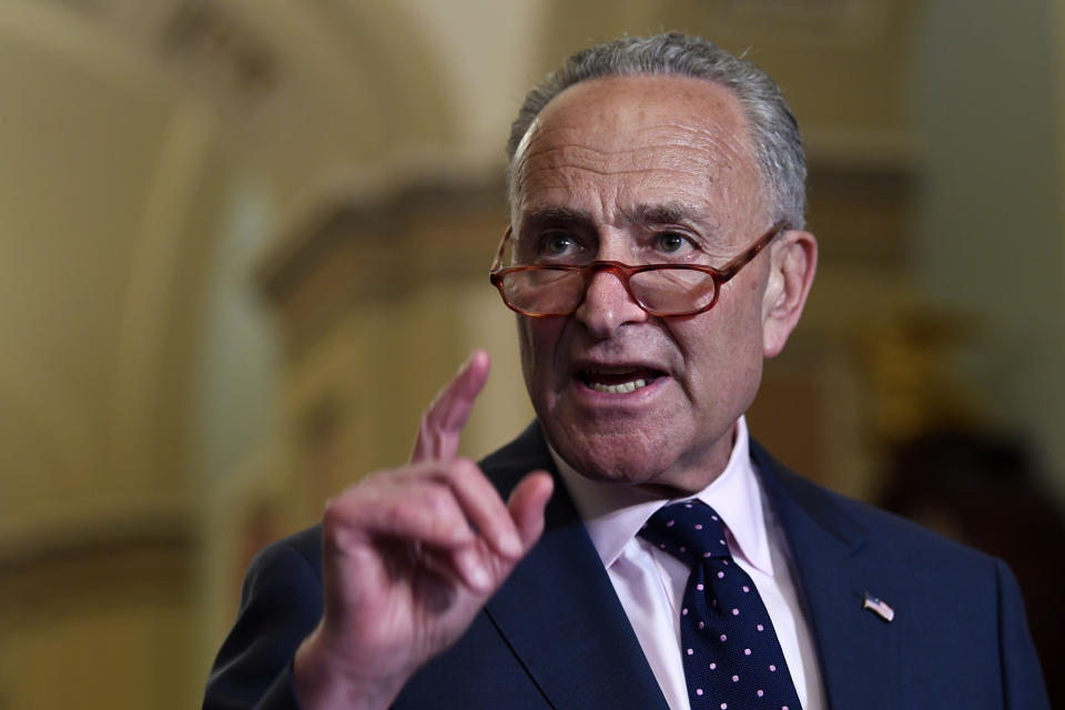 Senate Minority Leader Sen. Chuck Schumer of N.Y., center, speaks to reporters following the weekly policy luncheon on Capitol Hill in Washington, Tuesday, July 9, 2019. (AP Photo/Susan Walsh)