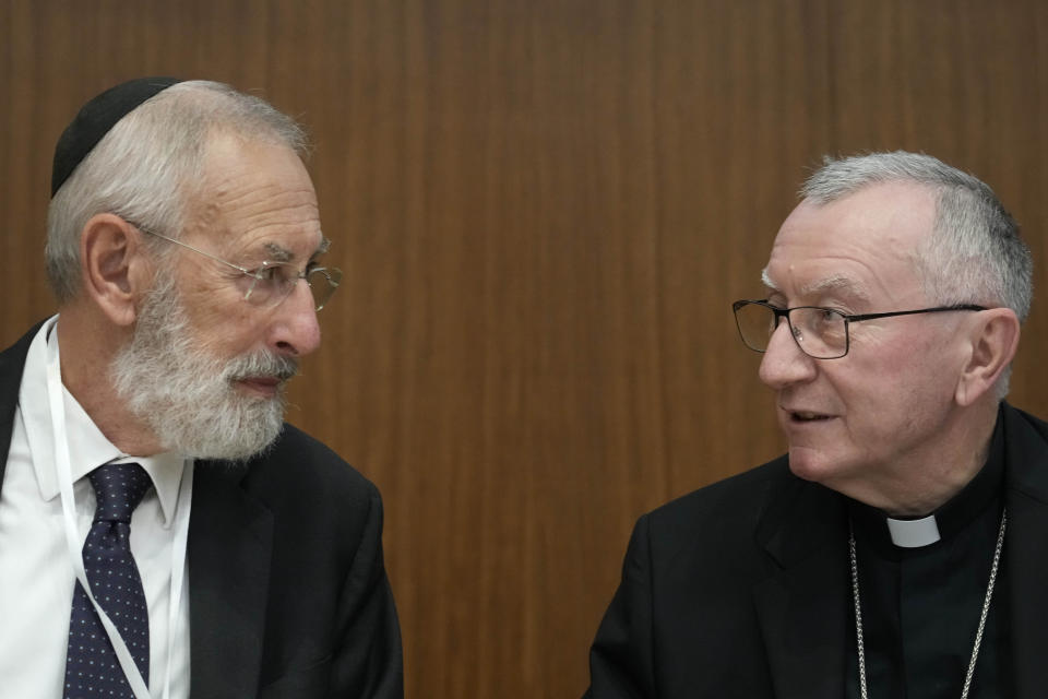 Rome's Chief Rabbi Riccardo Di Segni, left, talks to Vatican Secretary of State Pietro Parolin during the international conference "New documents from the Pontificate of Pope Pius XII and their Meaning for Jewish-Christian Relations: A Dialogue Between Historians and Theologians", at the Gregorian University in Rome, Monday, Oct. 9, 2023. (AP Photo/Gregorio Borgia)