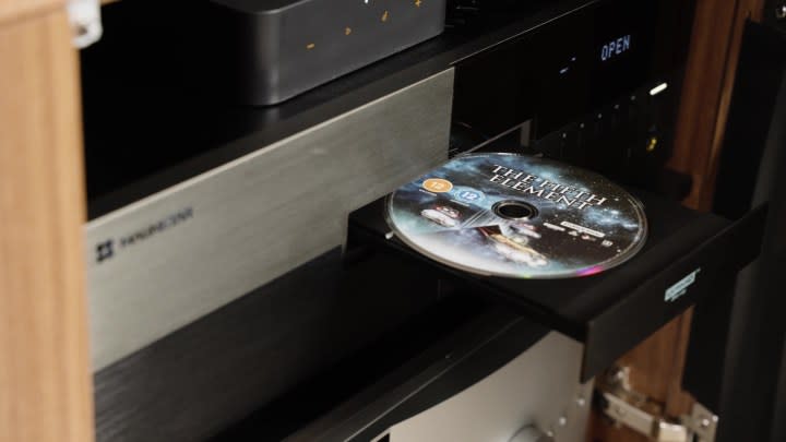 A Blu-ray disc being insterted into a Magnetar Blu-ray player. 