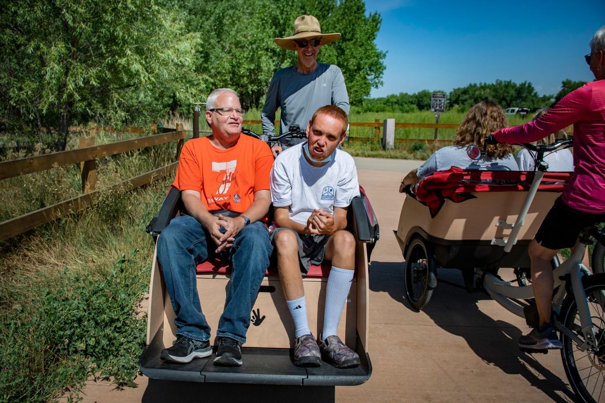 Cycling Without Age pilots Keith Williams and Ann Lahde provide rides in their electric trishaw bicycles along the Poudre River Trail in Greeley on Thursday, Aug. 4, 2022.