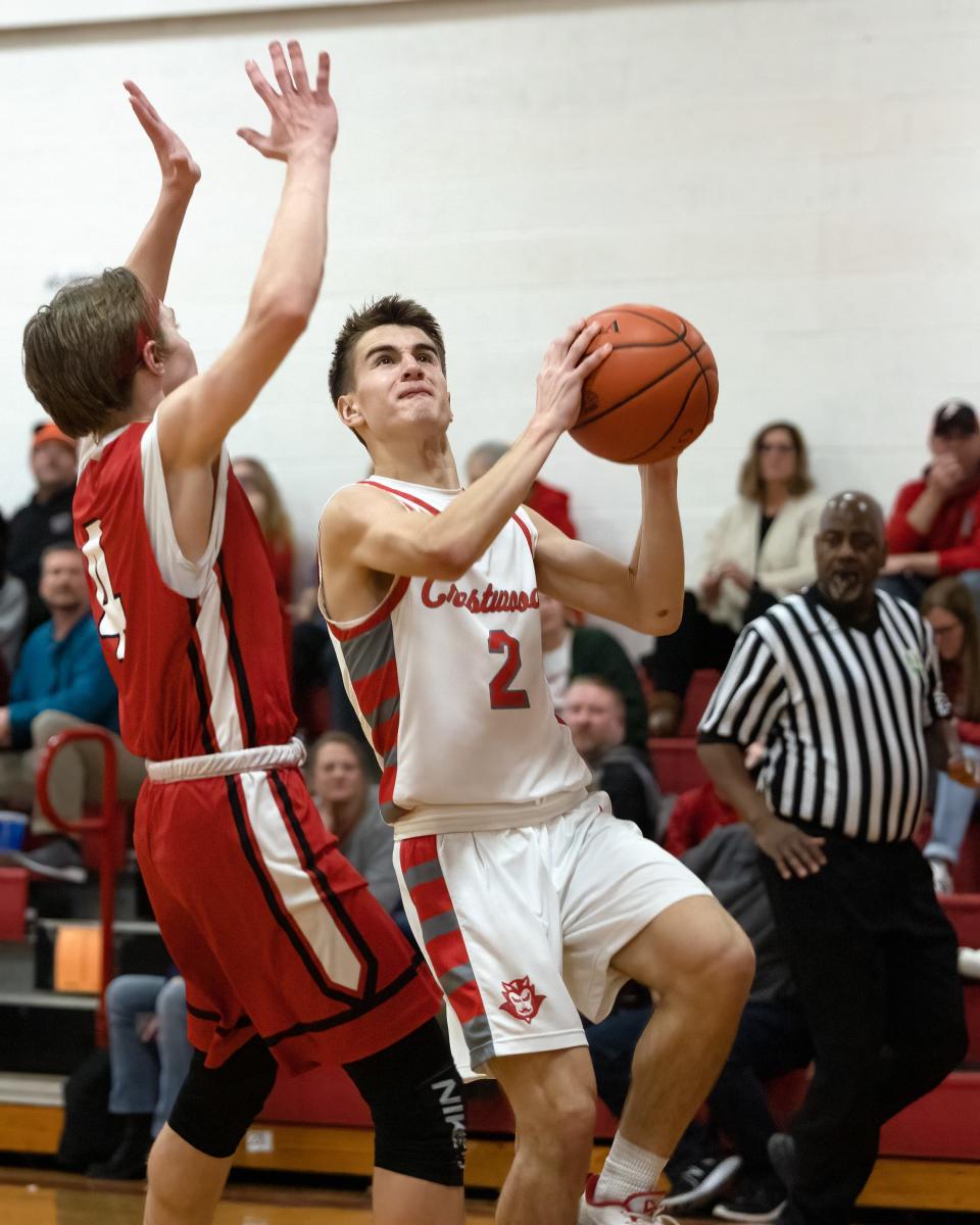 Crestwood sophomore Augie Schweickert looks for a lay-up during Monday night’s game against the Field Falcons in Mantua.