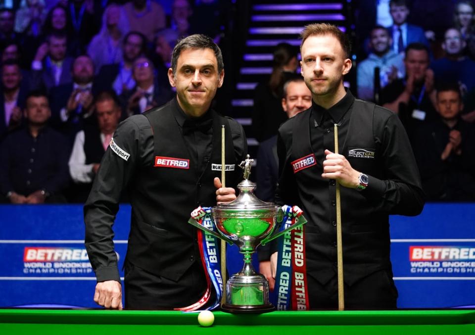 Ronnie O’Sullivan leads Judd Trump after the opening session of their World Snooker Championship final (Zac Goodwin/PA) (PA Wire)