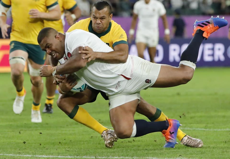 England's Kyle Sinckler scores a try against Australia during the Rugby World Cup quarterfinal match at Oita Stadium in Oita, Japan, Saturday, Oct. 19, 2019. (AP Photo/Christophe Ena)