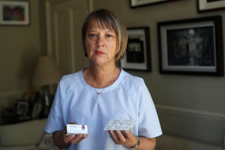 Georgina poses for a photograph with her insulin medical supplies in London