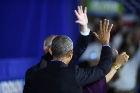 Former president Barack Obama acknowledges the crowd after rallying with New Jersey Democratic Gubernatorial candidate Jim Murphy in Newark, New Jersey, U.S. October 19, 2017. REUTERS/Mark Makela