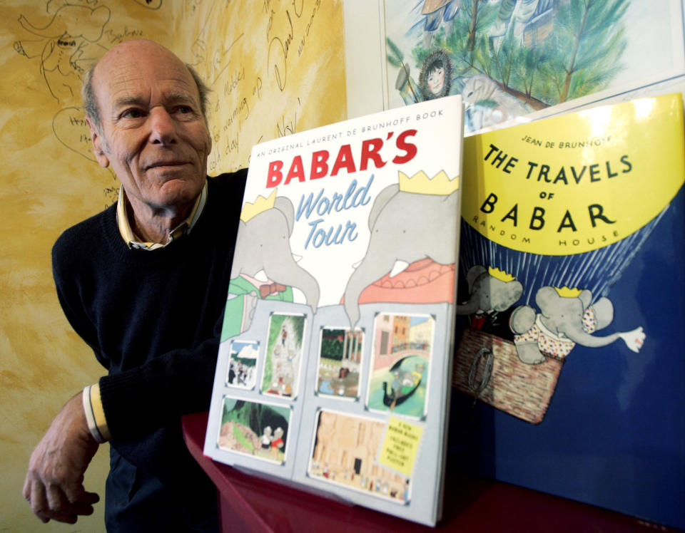 FILE - In this Friday, April 21, 2006 file photo, Babar author Laurent de Brunhoff poses for a photograph at Mabel's Fables bookstore in Toronto, Ontario, Canada. Notre Dame cathedral appears in the “Babar” children’s series. (Nathan Denette/The Canadian Press via AP)