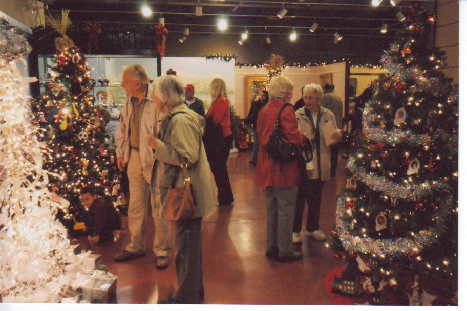 Visitors at the Festival of Trees enjoy the decorations.